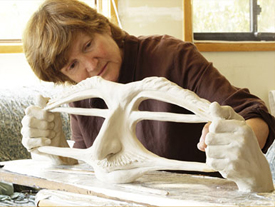 artist Susan Dorothea White working on clay for large bronze sculpture of Stretching the Imagination for Buhl Collection